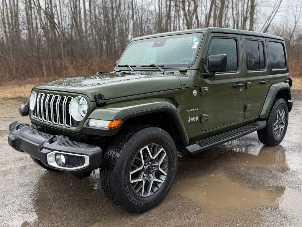 2024 Jeep Wrangler Sahara in Sarge Green — front three-quarter view