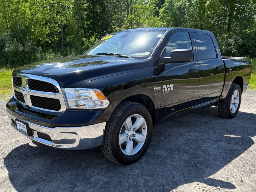 2022 RAM 1500 Classic SLT in Diamond Black Cry — front three-quarter view