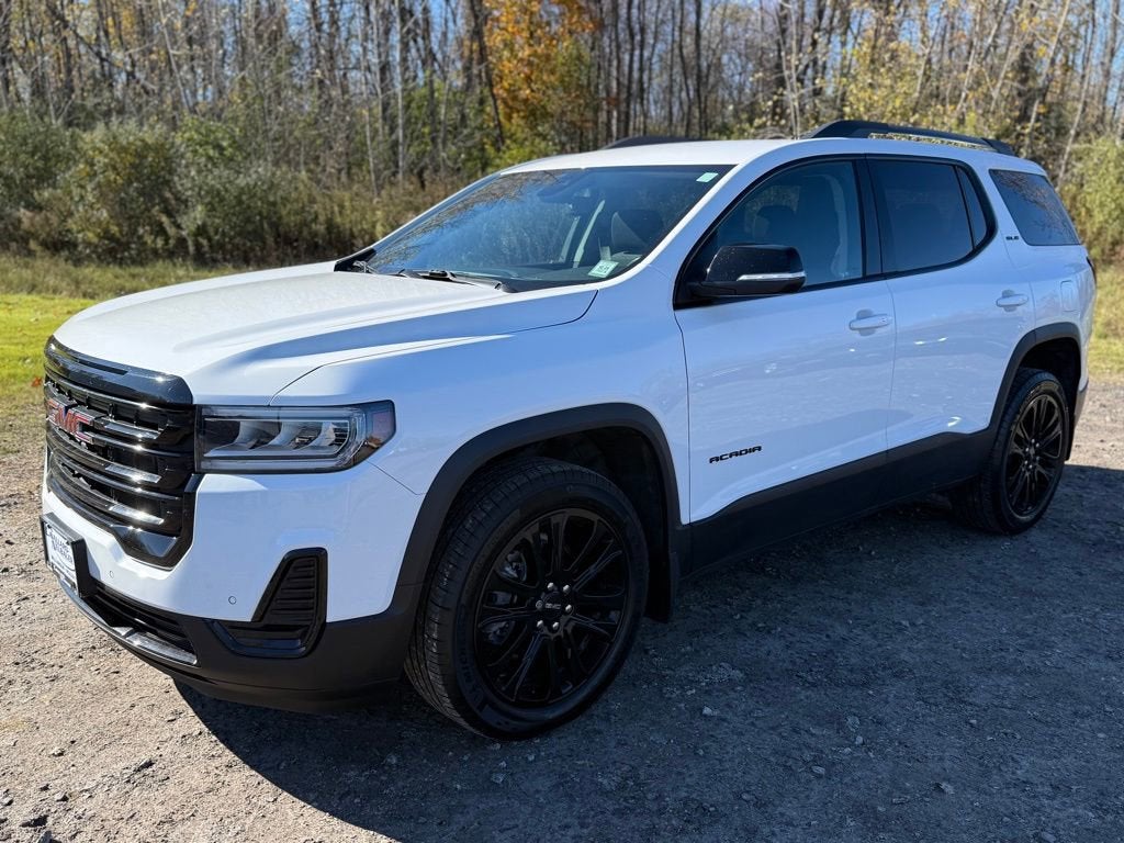 2023 GMC Acadia SLE in Summit White — front three-quarter view